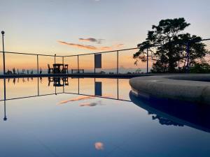 a pool of water in front of a fence at Finca Hotel Resplandor Quindiano in Montenegro +46 photos