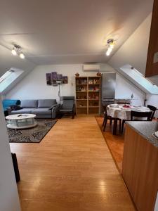 a living room with a couch and a table at apartment in Biely Kostol