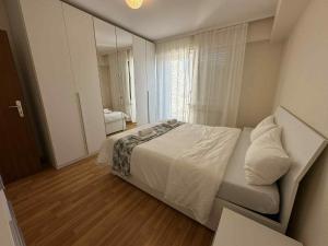 a small bedroom with a bed and a window at Rooftop 1 bed sleeps 4 in Luxembourg