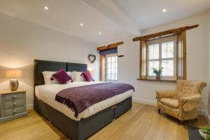 Ένα ή περισσότερα κρεβάτια σε δωμάτιο στο Cark House Cottage