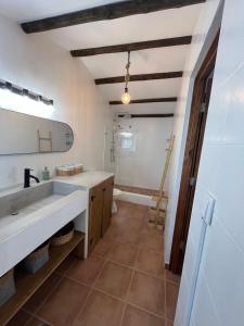 a bathroom with a sink and a toilet and a mirror at Cantinho do Baloiço in Vila Viçosa +37 photos