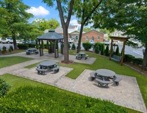 a park with picnic tables and a gazebo at Carters Court Grand Escape in Franklin