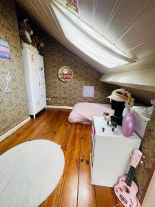 a room with a bed and a room with a guitar at La campagne à Paris in Bagnolet +28 photos