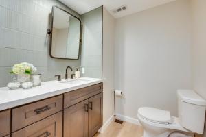 a bathroom with a sink and a toilet at Waterfront Gem with Boat Dock and Lift in Lakewood! in Lakewood +23 photos