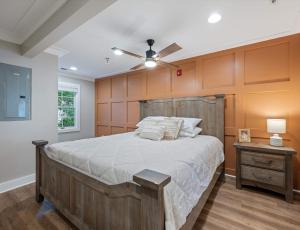 a bedroom with a large bed with a wooden headboard at Carters Court Serene Suite in Franklin +23 photos