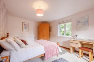 Postel nebo postele na pokoji v ubytování Granary Cottage