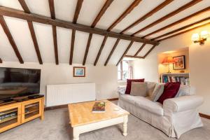 Posezení v ubytování Granary Cottage