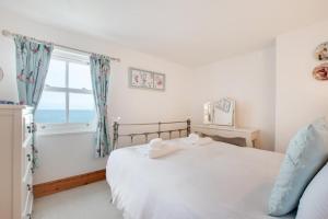 Postel nebo postele na pokoji v ubytování Ebor Cottage South