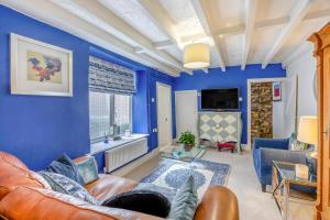 Et opholdsområde på Primrose Cosy Cottage