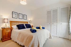 En eller flere senge i et værelse på Pauntley Cottage