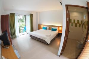 Postel nebo postele na pokoji v ubytování Wandee Bed & Breakfast
