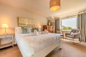 Ένα ή περισσότερα κρεβάτια σε δωμάτιο στο Smithies Cottage