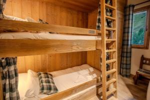 Postel nebo postele na pokoji v ubytování Roche des Fours 210