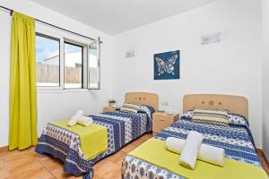 Ένα ή περισσότερα κρεβάτια σε δωμάτιο στο Villa Amalia by Villa Plus +33 φωτογραφίες