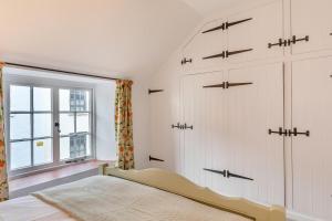 Postel nebo postele na pokoji v ubytování Hart Cottage