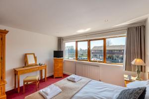 Voodi või voodid majutusasutuse Swan House toas