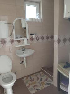 a bathroom with a toilet and a sink at Ema in Bajina Bašta