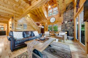 a living room with a couch and a table at The Holiday Cabin at Lake Lure in Lake Lure