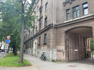 a motorcycle parked in front of a building at Compass apartment in Tallinn
