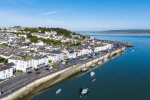 an aerial view of a town with boats in the water at Hideaway in Appledore