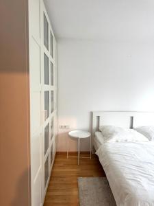 Ένα ή περισσότερα κρεβάτια σε δωμάτιο στο AM Apartment