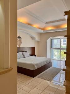 a bedroom with a bed and a window at Casa Bonampak 1 in Cancún +18 photos