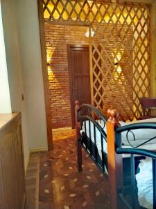 a room with a staircase and a room with a door at Discover Kinchkha in Satsiskvilo
