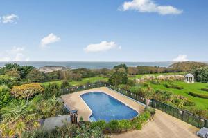 an aerial view of a swimming pool in a garden at Sennen - St Ives in Carbis Bay