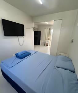 Postel nebo postele na pokoji v ubytování Estúdio próximo ao aeroporto com vaga na garagem + 5 fotografií