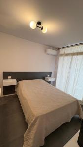 Postel nebo postele na pokoji v ubytování San Juan 2