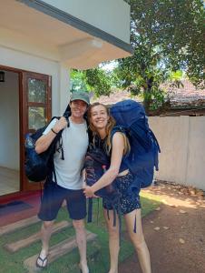 two people with backpacks posing for a picture at GB Royal Stay Anuradhapura in Anuradhapura