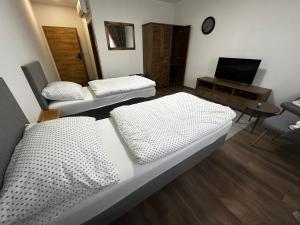 Ένα ή περισσότερα κρεβάτια σε δωμάτιο στο Luxury Private Rooms