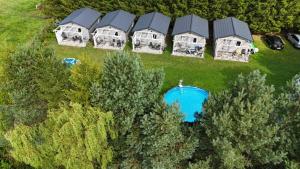 an aerial view of a row of houses with a pool at U Joanny in Kopań +37 photos