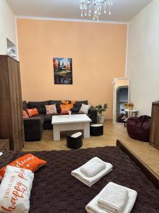 a living room with a couch and a table at Bella in Tbilisi City