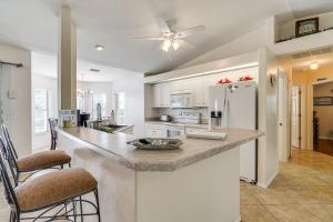 a kitchen with a large counter and a refrigerator at Near Sun Splash Waterpark Coral Princess Oasis in Cape Coral