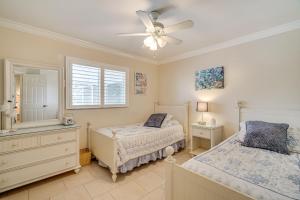 a bedroom with two beds and a ceiling fan at Near Sun Splash Waterpark Coral Princess Oasis in Cape Coral +17 photos