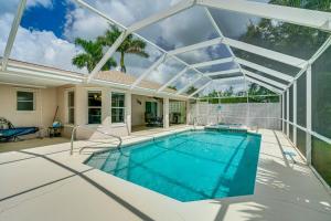 an indoor swimming pool with a glass roof at Near Sun Splash Waterpark Coral Princess Oasis in Cape Coral