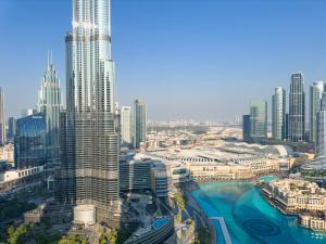 an aerial view of a city with tall buildings at GRANDE RESIDENCES with a direct Burj Khalifa view and Private Fountain Show at 62nd floor with DXB AIRPORT VIP Shuttle for 6 guests in Dubai +73 photos
