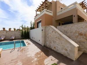 an image of a villa with a swimming pool at New villa with private pool, privacy, near sea and Arkadi monastery on NW coast in Roúpai