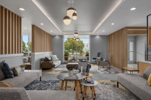 a living room with couches and tables at TownePlace Suites by Marriott Nampa in Nampa