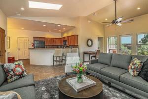 a living room with a couch and a table at Sedona Retreat with Hot Tub and Views for Family in Sedona