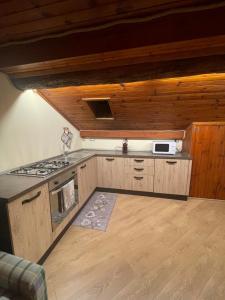 a kitchen with a stove and a stove top oven at Casa Vacanze La Vite in Bordogna +34 photos