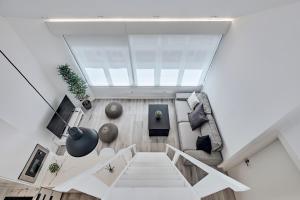 an overhead view of a living room with a glass ceiling at San vicente in A Coruña