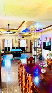 a living room with a pool table and a pool table at Chateau La Princesa rooms with garden, Bar & billiard in Puerto Princesa City