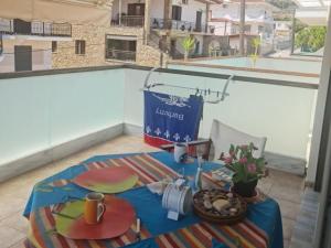 a table with a bowl of food on top of a balcony at Holiday Home in Likoporia near Beaches in Likoporiá