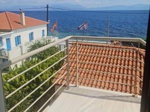 a balcony with a view of the ocean at Holiday Home in Likoporia near Beaches in Likoporiá +5 photos