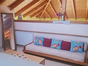 a living room with a couch with pillows on it at Holiday Home in Likoporia near Beaches in Likoporiá