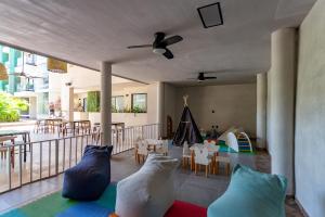 a living room with pillows on the floor at Bakal Studios in Tulum