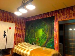 a room with a painting on the wall with a bed at THE HIGHEST VILLA IZUMI - Vacation STAY 16413v in Nakatsugawa