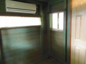 a room with a window and a heater and a door at Eleven Auto Camp Park - Vacation STAY 44748v in Kururi